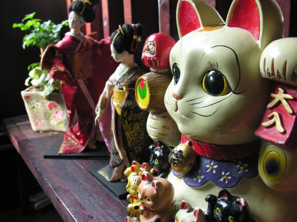 Kiinalainen onnekkaan kissan tarina - Maneki Neko - Maneki Neko -symbolismi